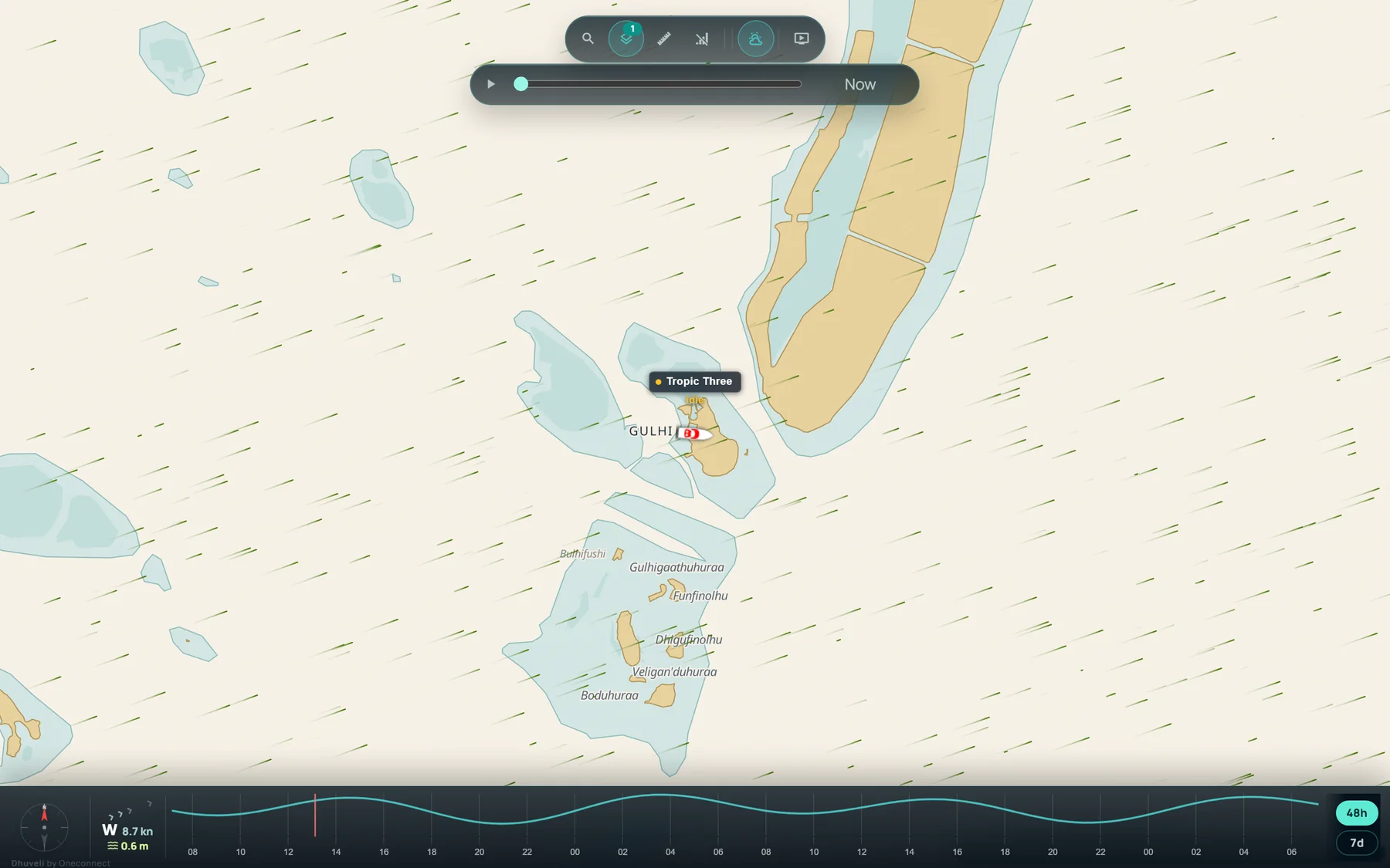 The live map on Dhuveli Daylight, our own chart: islands, reefs and lagoons around Gulhi with a vessel on it and the wind drawn over the sea